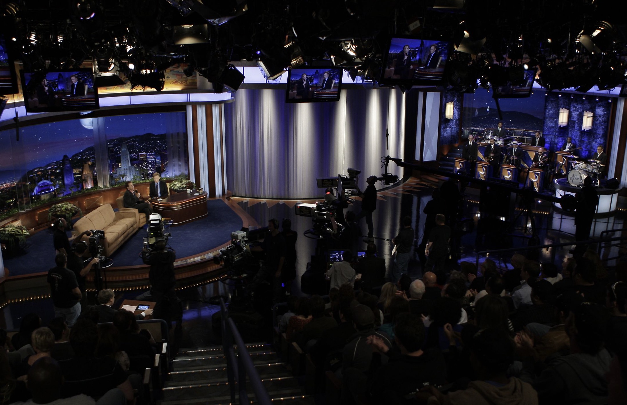 View from an audience seat from a late night talk show hosted by Conan O'Brien.